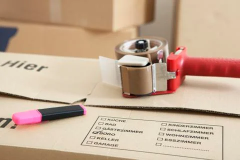 Moving box with tape Stock Photos