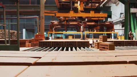 Moving bricks on a conveyor belt in the first person 動画素材 163290190