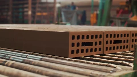 Moving bricks on the conveyor Stockbeeldmateriaal 163290221