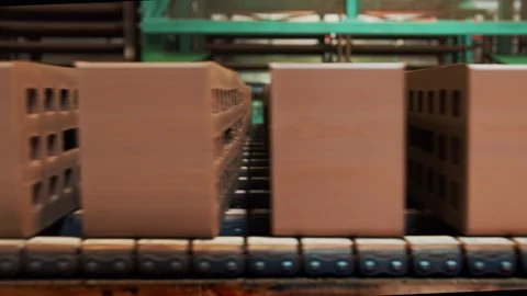 Moving bricks on the conveyor Stockbeeldmateriaal 163290784