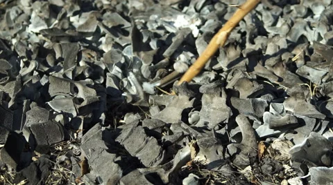 Moving Burned Bones With a Stick Stock Footage 63017214