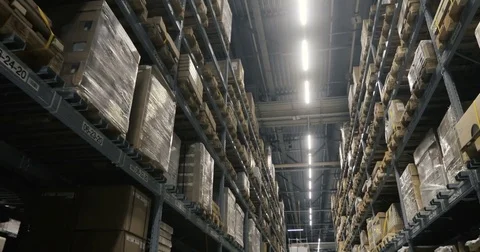 Moving camera along storehouse of goods in wholesale shop. Multi level modern Stock Footage 85312322