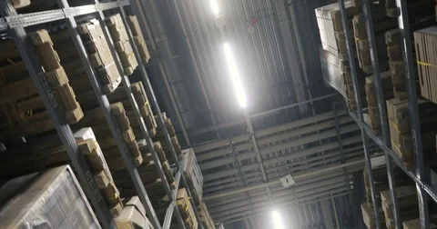 Moving camera along storehouse of goods in wholesale shop. Multi level modern Stock Footage 85320482