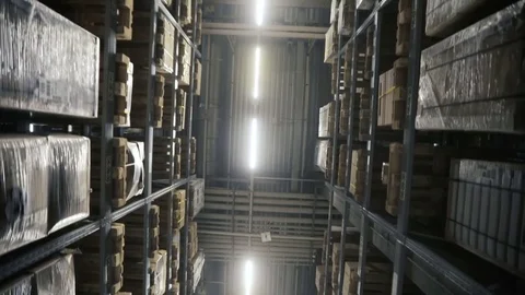 Moving camera along storehouse of goods in wholesale shop. Multi level modern Stock Footage 85321024