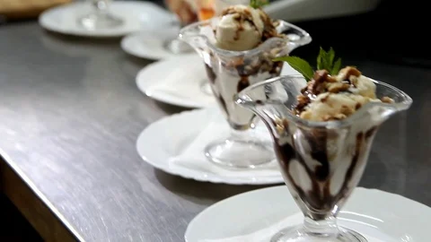 Moving the camera along the table with portions of ice cream Stock Footage 123624105