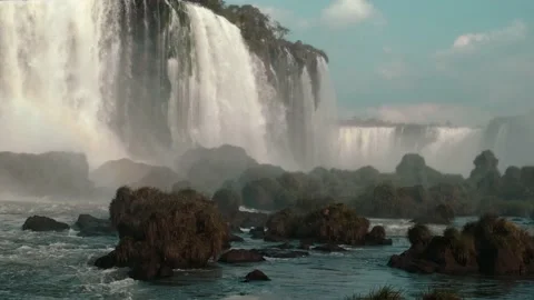 Moving camera around the waterfall with rainbow Stock Footage 138174940