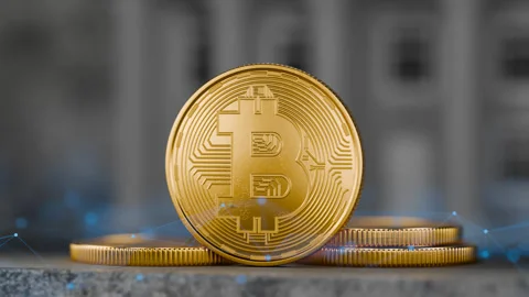 Moving the camera away from the Bitcoin coin. Stack of bitcoin coins. Stock Footage 258448066