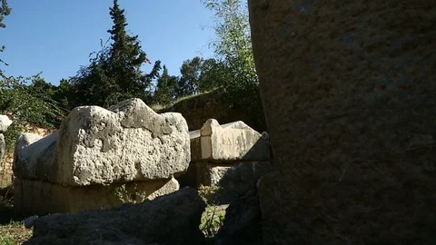 Moving camera besides old Roman graves and ruins at Tyre, Lebanon Stock Footage 119103086