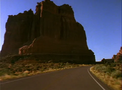 Moving camera down winding hiway Utah Arches park Video stock 230923664