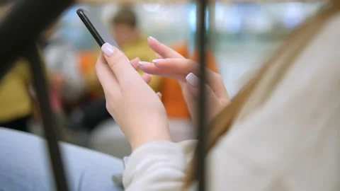 Moving camera shot female hands use smartphone in shopping mall Caucasian 30s Stock Footage 257797800