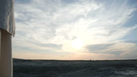 Moving the camera from the sky to a strong man in a kimono that meets the sun Video stock 91867467