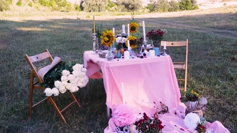 Moving camera toward the table served for date and decorated with leaves Stock Footage 140849436