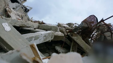 Moving camera towards ruins of a devastated building in Homs, Syria Stock Footage