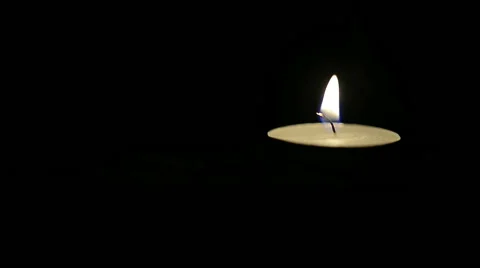 Moving Candle Flame on Black Stock-Footage 48271725