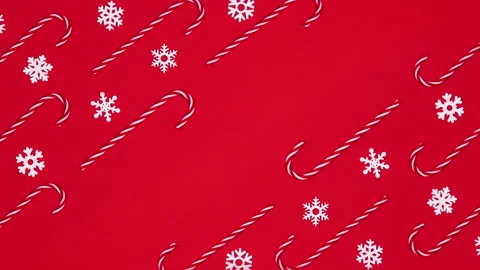 Moving candy canes and snowflakes on red theme with empty space. Stop motion Stock Footage 166220768