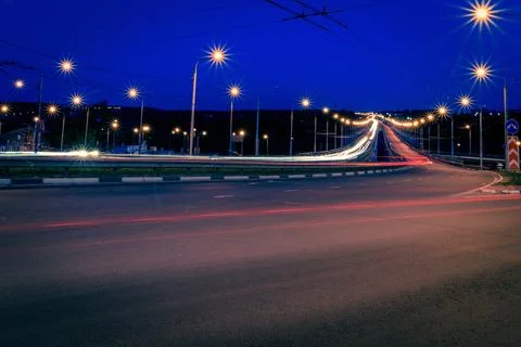 Moving car with blur light through city at night. Stock Photos