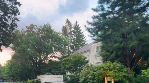  A moving car drives along a public road in a residential neighborhood. Stock Footage 343676756