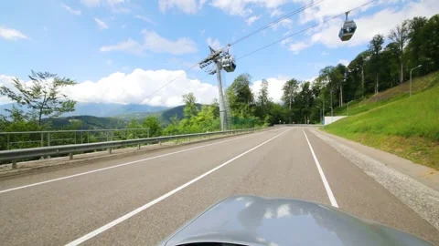 Moving in car on road under funicular among green mountains at summer, Sochi, Stock Footage 276363350