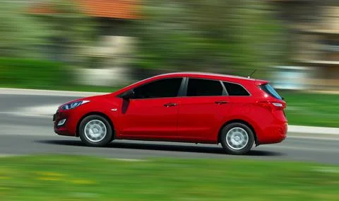 Moving car, stationwagon Stock Photos