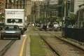Moving car traffic beside empty tram line Footage
