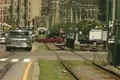 Moving car traffic beside empty tram line Footage