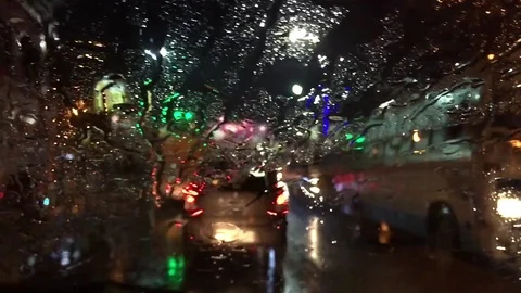 Moving car with wet window screen at night Stock Footage 104842502