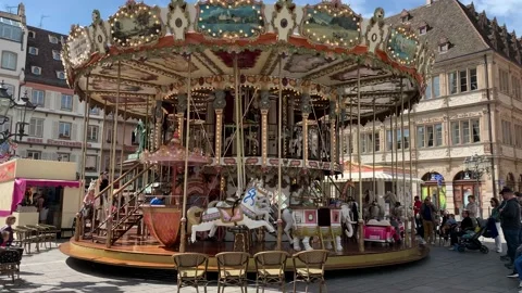 Moving Carousel (Marry go round) at the Strasbourg old town. Strasbourg, France Stock Footage 197389433