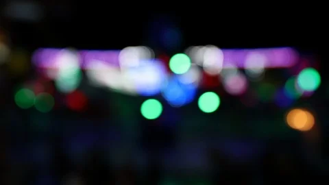 Moving carousel ride with blurry lights at during the night Stock Footage 124312841