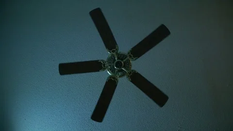 Moving ceiling fan in a hotel room Stock Footage