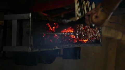 Moving Charcoal when making Indonesian chicken satay in traditional way.tas.. Stock Footage 294282676