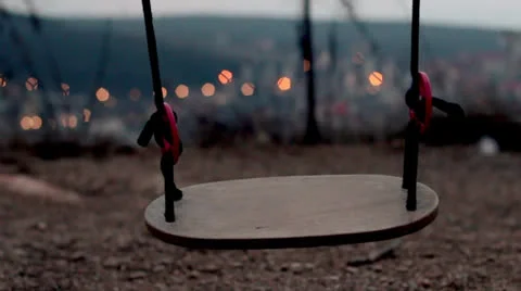 Moving children's swing at evening Видео 23683799