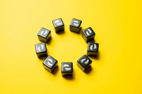 Moving in circles without end. Circle made of blocks with footprints. Endless Stock Photos