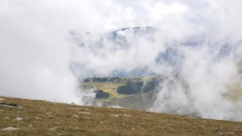 Moving cloud landscape in high mountains Stock Footage 297792436
