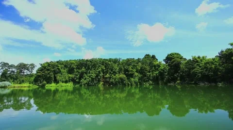 Moving cloud over pond 스톡 동영상 51312704