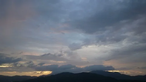 Moving cloud sky background above silhouette mountain at sunset time Stock Footage 101392273