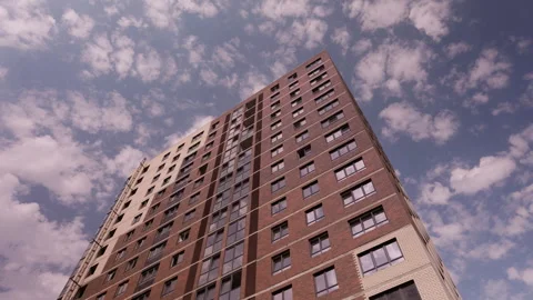 Moving clouds above high rise residential building in time lapse Vidéo 342610881