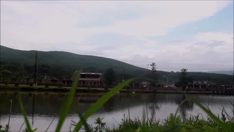 Moving clouds above lake and mountains - time-lapse 動画素材 158334455