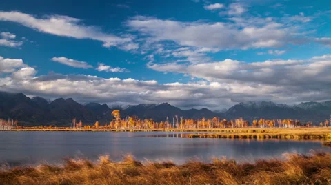 Moving clouds above a lake Stock Footage 55314345