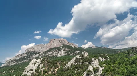 Moving clouds above a mountain Stock Footage 55169809
