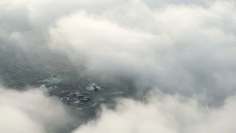 Moving clouds above the ocean with beatiful coastline captured from above Video stock 111275695