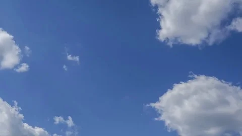 Moving clouds and blue sky time lapse Stock Footage 76423294