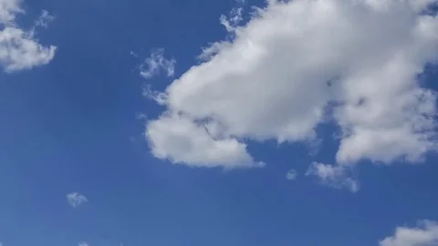 Moving clouds and blue sky time lapse Stock Footage 77003651