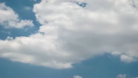 Moving clouds and blue sky time lapse Stock Footage 77437347