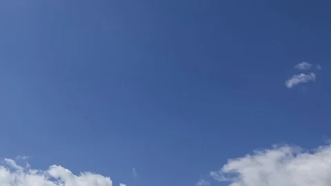 Moving clouds and blue sky time lapse Stock Footage 77441946