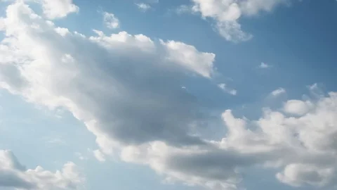 Moving clouds and blue sky time lapse Stock Footage 77688437