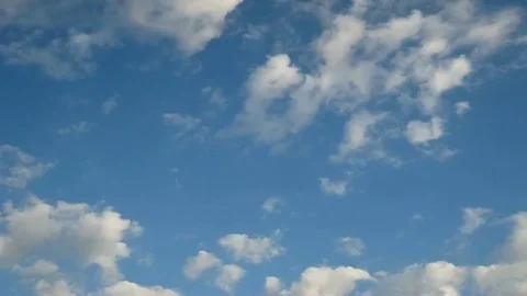 Moving clouds and blue sky time lapse Stock Footage 77723820