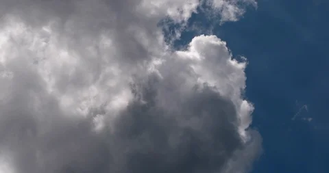 Moving clouds and blue sky time lapse, Beautiful cloudscape with large, building Stock Footage 87956987