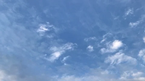 Moving clouds and blue sky with plane Stock Footage 111925922