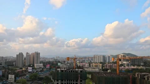 Moving Clouds and city architecture day to night with traffic Stock Footage 157379715