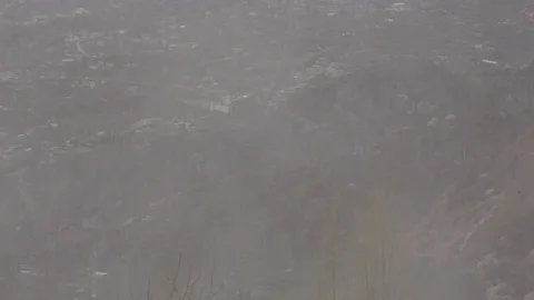 Moving Clouds and rain falling over the Hunza Stockbeeldmateriaal 115574913